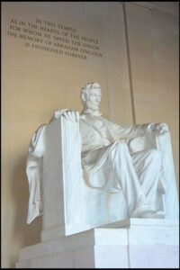 Lincoln Memorial - Lincoln with dedicating inscription above.